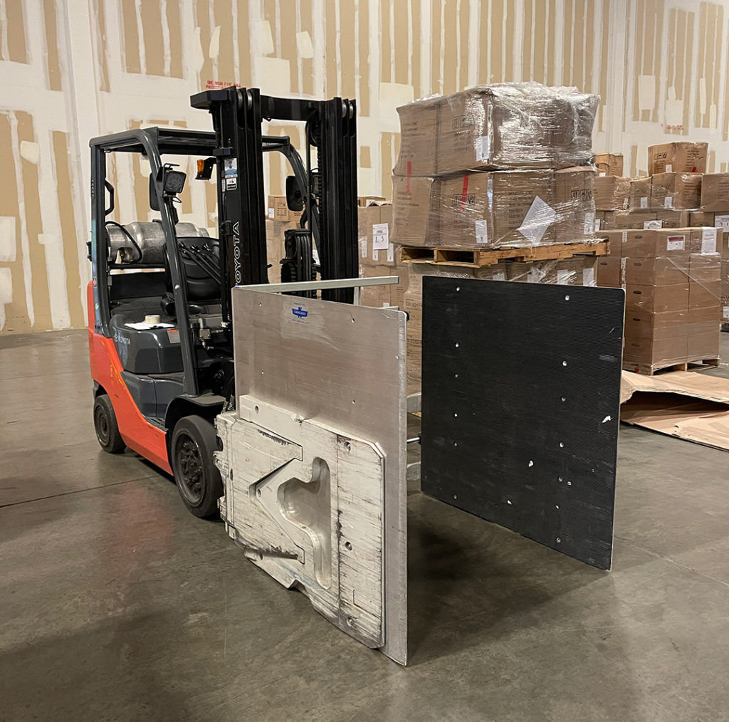 Forklift with pallets in background in Westbridge